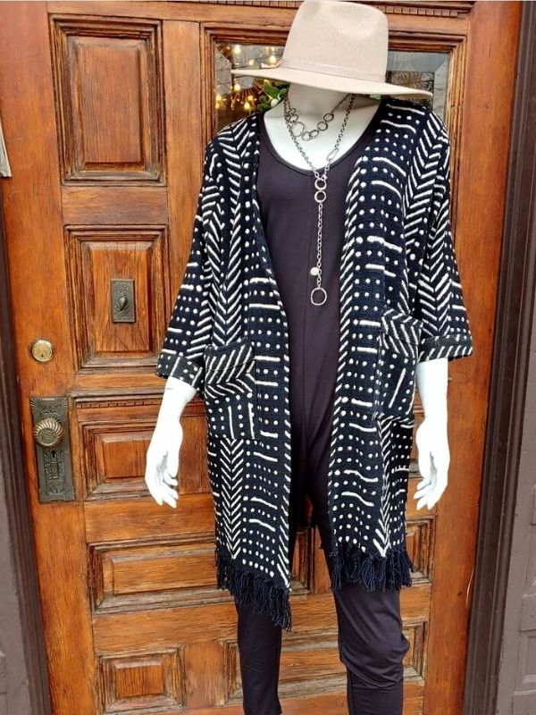 layered silver chain circle necklaces on mannequin